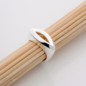 A close-up of the Eye Ring in brushed and polished sterling silver, highlighting its sculptural design by Daniel Bentley. The piece symbolises protection and awareness, embodying refined craftsmanship and quiet strength.