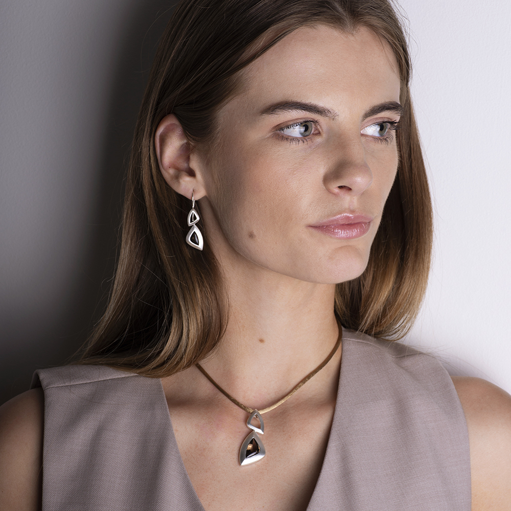 South Atlantic Pendant and Drop Earrings in polished sterling silver with smokey quartz, designed by Daniel Bentley. Stunning pendant inspired by the vibrant energy and fluid forms of the South Atlantic coast.