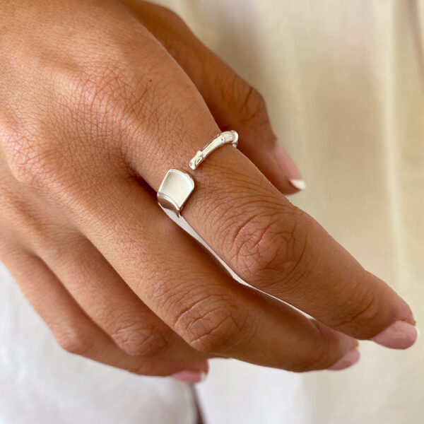 Bamboo Ring worn on sun-tanned skin.