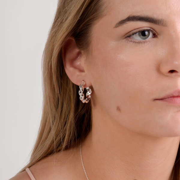 The Voyager hoop earrings in high polished silver is a style statement