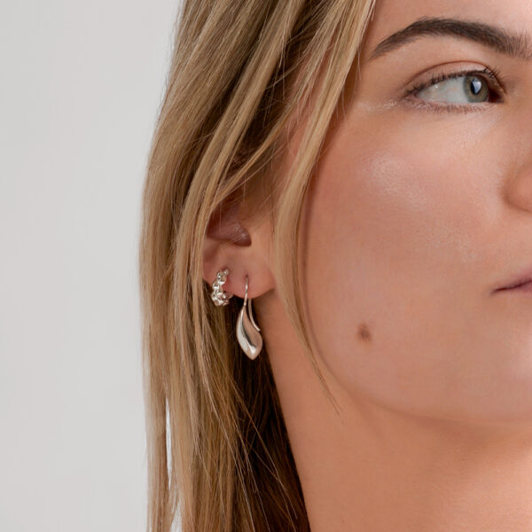 The Voyager drop earrings paired with the Voyager mini hoops