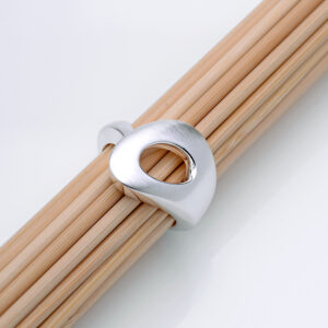 Outback Fossil Ring in sterling silver, sitting on a bamboo sticks. Timeless, organic design inspired by the shapes and textures of the Australian landscape.