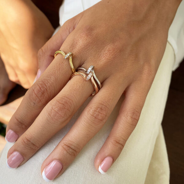 Pirouette Diamond Ring in 18ct yellow gold featuring nine 0.01ct H Si diamonds, inspired by a spinning ballerina