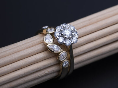 Custom diamond wedding ring by Daniel Bentley Jewellery, shown with client’s classic engagement ring.
